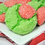 red and green crinkle cookies on a white plate with the name in text for pinterest