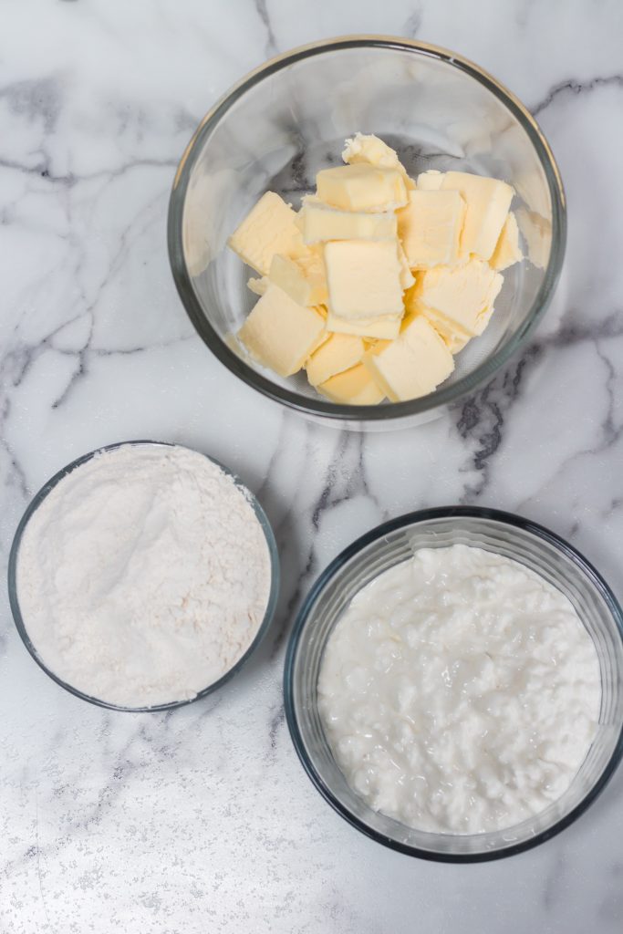 glass bowls filled with butter, flour, and cottage cheese.