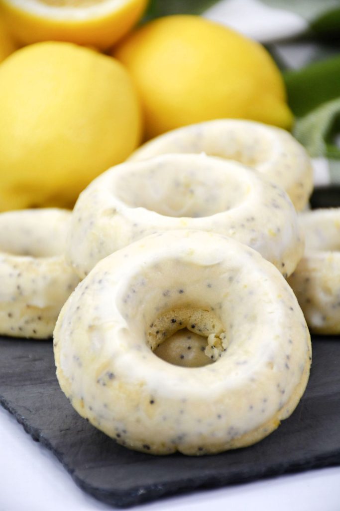 lemon poppy seed donuts on serving platter.
