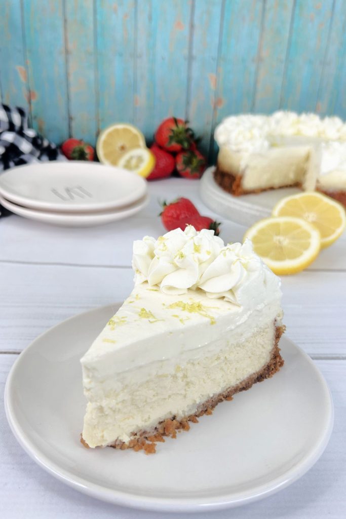 Slice of sour cream lemon cheesecake on a small plate.