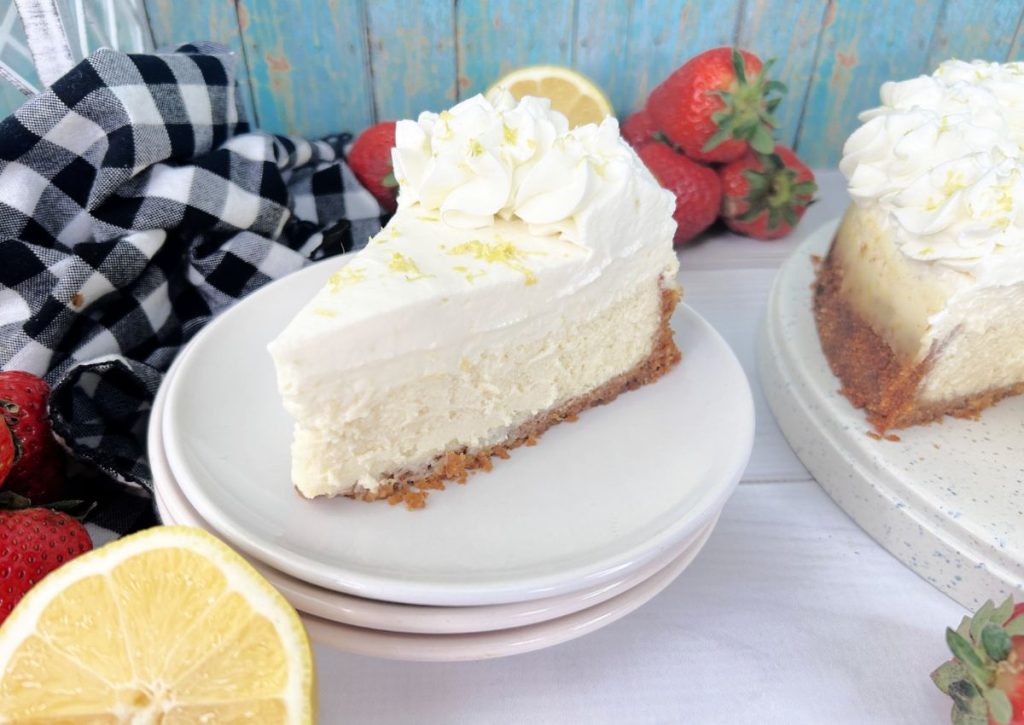 Slice of sour cream lemon cheesecake on a small plate.