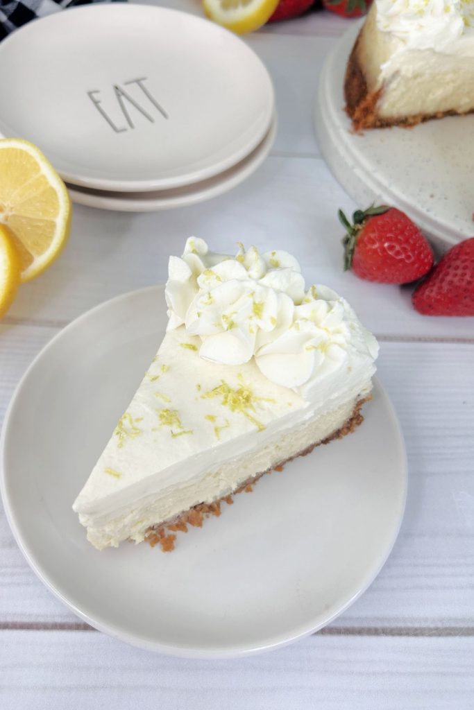 Slice of sour cream lemon cheesecake on a small plate.