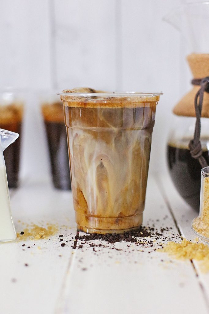 Finished drink in a plastic cup.