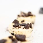A close up of Oreo Cheesecake Bites on a white plate.