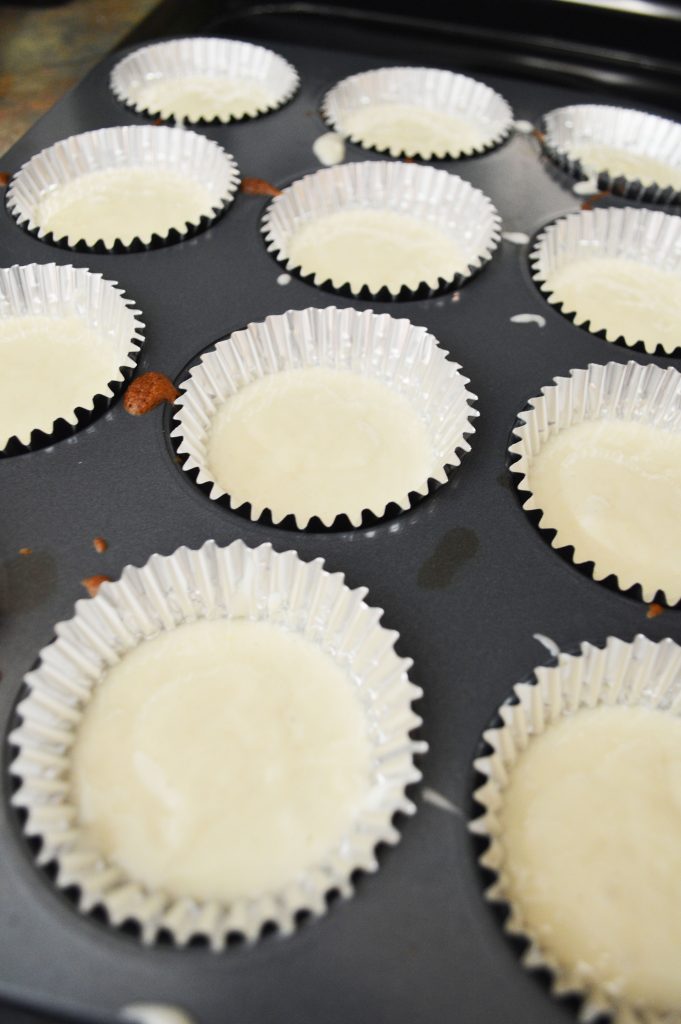adding the cupcake batter to the cupcake liners