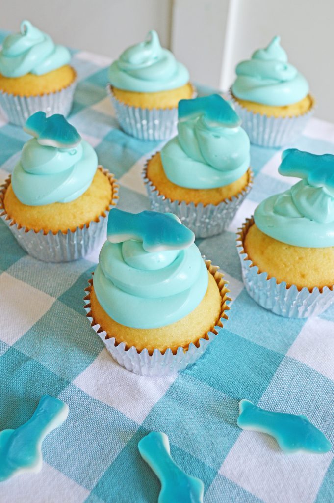 picture of many shark cupcakes on the table